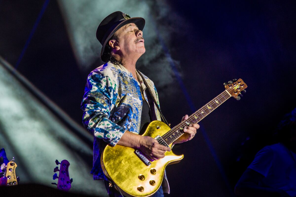 Carlos Santana performs.