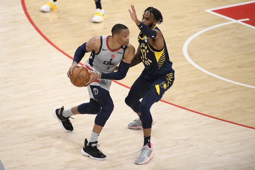 Washington Wizards guard Russell Westbrook (4) in action against Indiana Pacers forward Oshae Brissett (12) during the second half of an NBA basketball Eastern Conference play-in game, Thursday, May 20, 2021, in Washington. (AP Photo/Nick Wass)