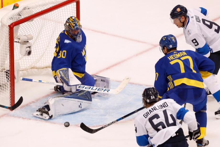 Swedish goalie Henrik Lundqvist makes a save on a third period shot during a game against Finland on Sept. 20.