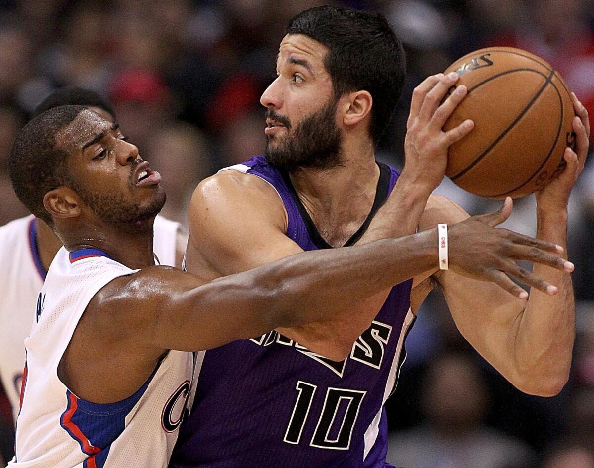 Clippers point guard Chris Paul tries to steal the ball from Kings guard Greivis Vasquez during a game earlier this season.