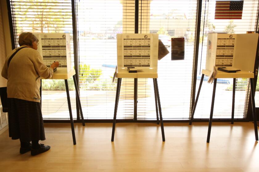 Olga Korn votes in the Los Angeles city election this week. Voters in two of California's senate districts cast ballots next week.