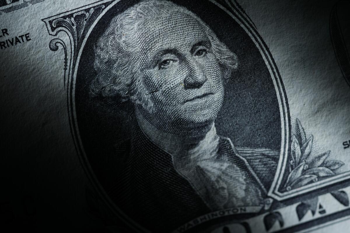 The likeness of George Washington is seen on a U.S. one dollar bill
