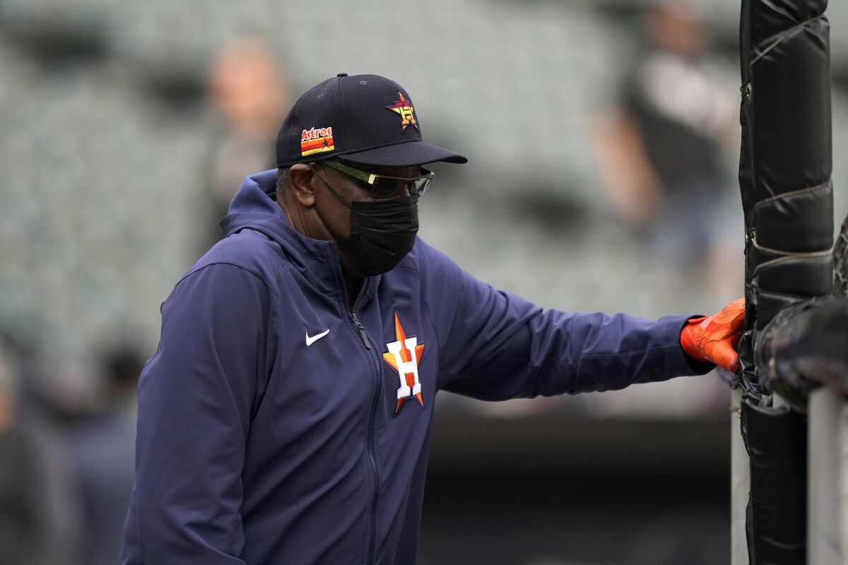 Houston Astros manager Dusty Baker watches warmups before Game 3 of a baseball American League Division Series.