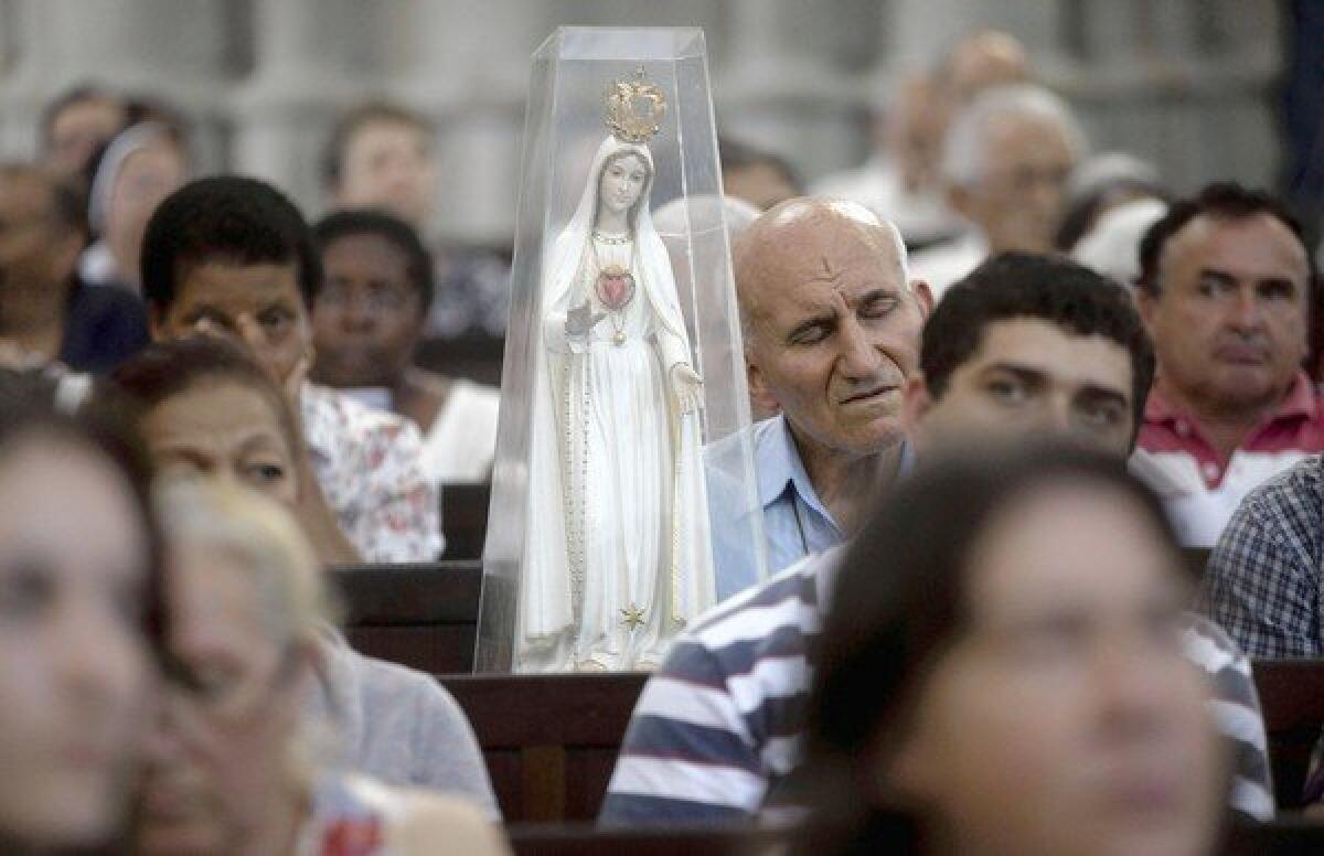 Worshipers gather Friday in Sao Paulo, Brazil, for a special Mass in honor of outgoing Pope Benedict XVI. Nineteen cardinals from Latin America are expected to be among those who will choose Benedict's successor.