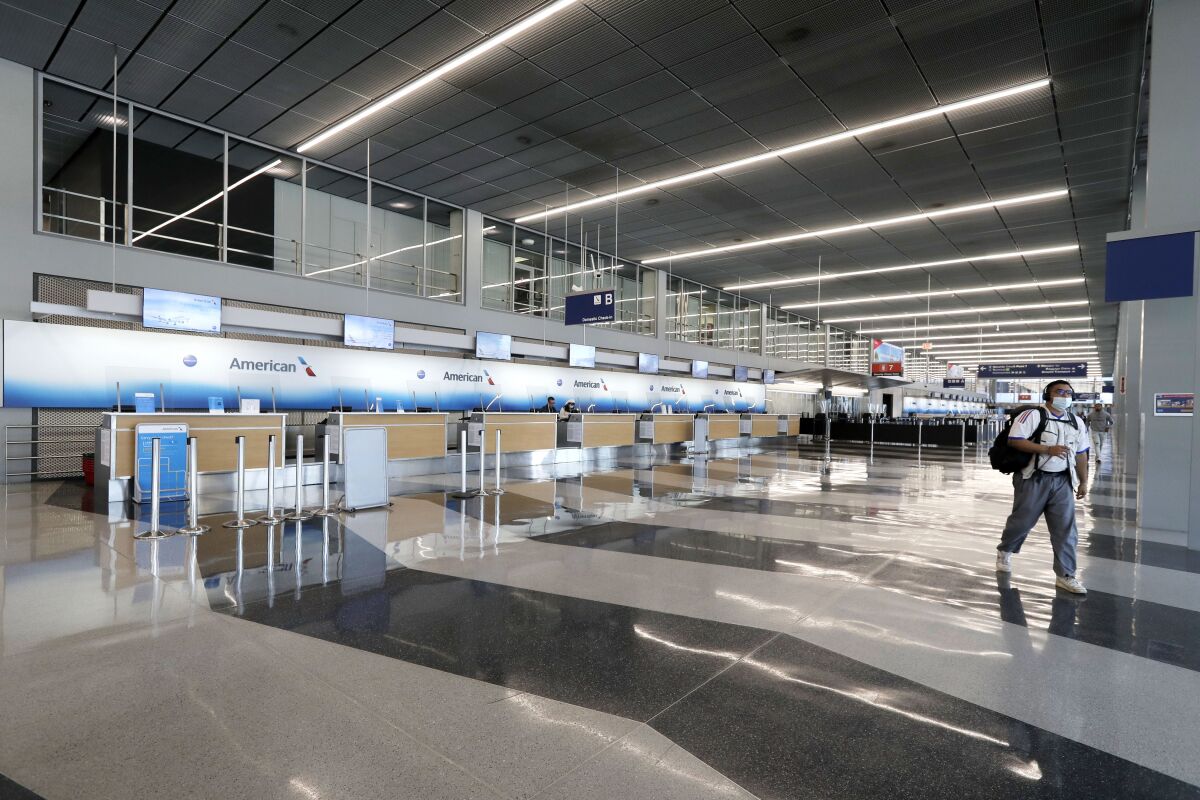 The American Airlines ticket counters at Chicago's O'Hare International Airport are empty on June 16.