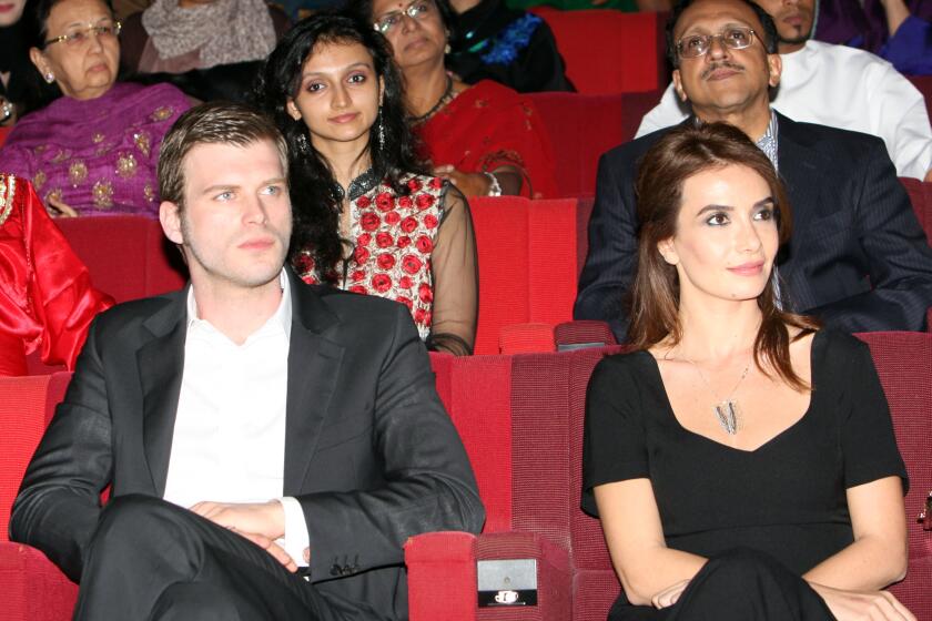 Actor Kivanc Tatlitug, left, pictured at a film festival in 2012, was one of the stars of the telenovela "Gumus." The Turkish drama was the start of a global obsession with Turkish epics, known as dizi, which have vaulted Turkey into the second largest worldwide distributor of television shows after the U.S.