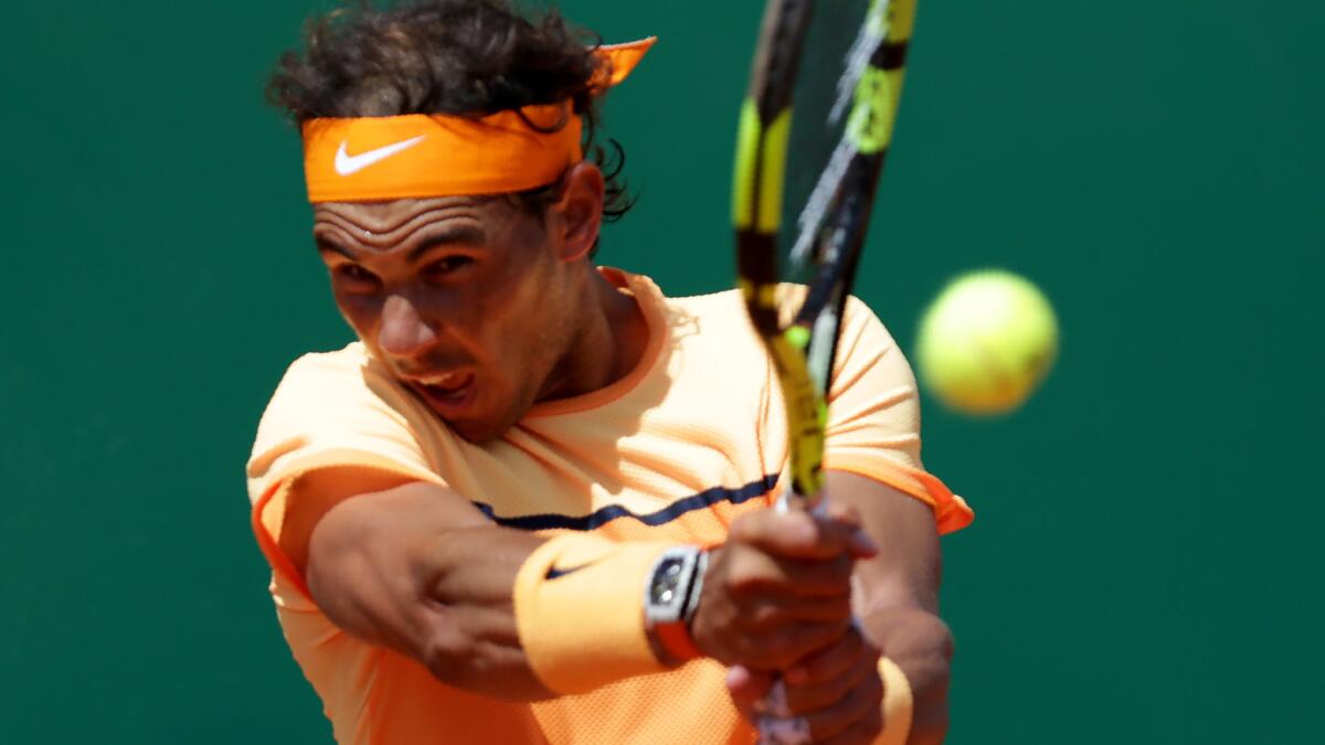 Rafael Nadal returns a shot against Stan Wawrinka during their Monte Carlo Masters quarterfinal match on Friday.