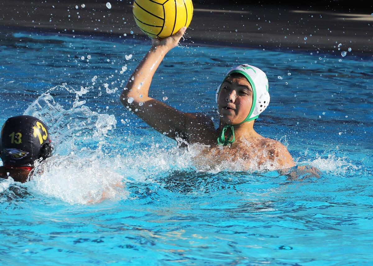 Costa Mesa's Nate Ruiz (3) looks for a pass during Wednesday's match.