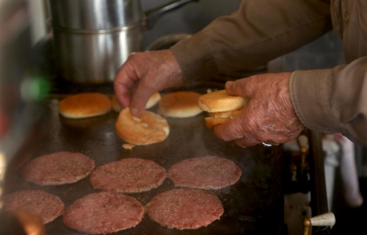 Bill Elwell, 93, is still flipping burgers at his roadside stand.