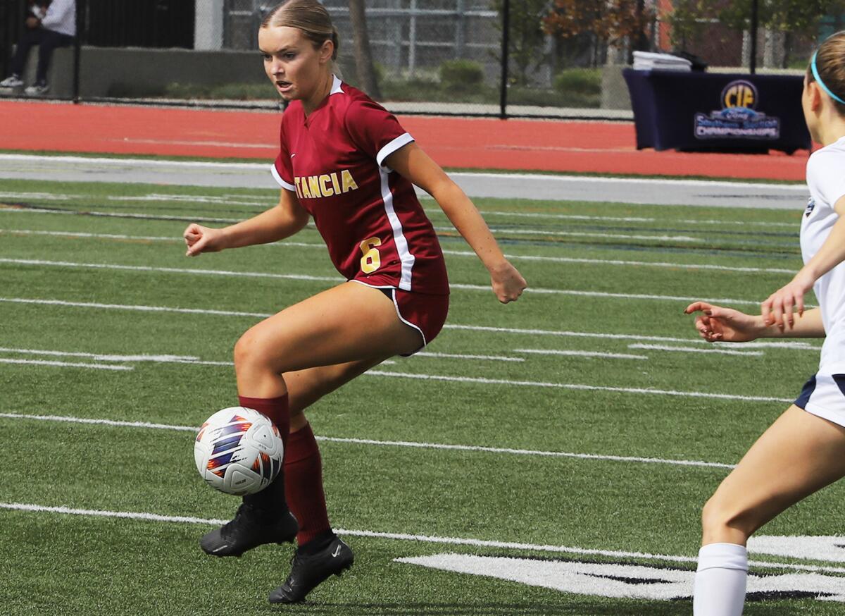 Tatum Cowie (6) passes downfield for Estancia against Campbell Hall during Saturday's match.