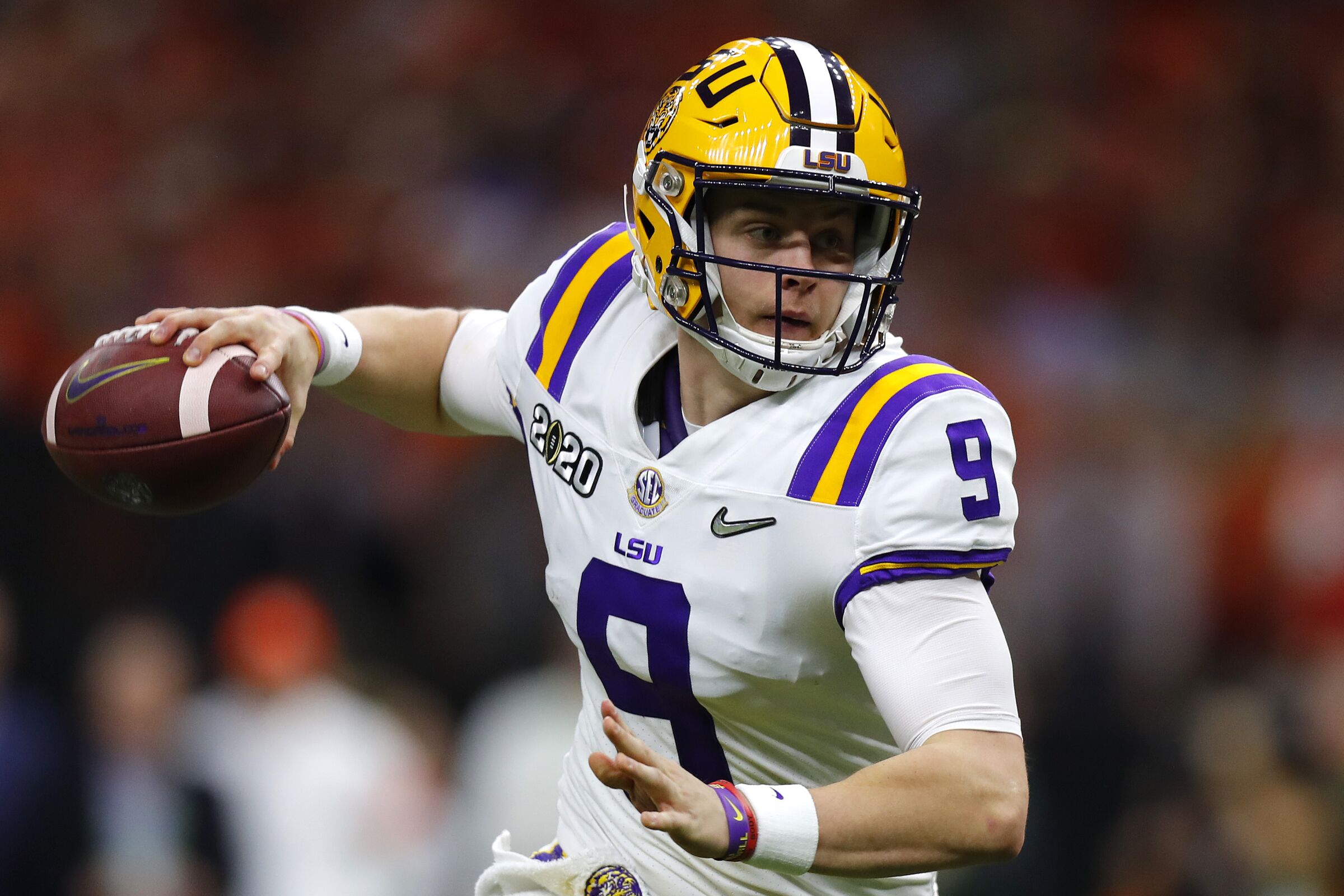 NEW ORLEANS, LOUISIANA - JANUARY 13: Joe Burrow #9 of the LSU Tigers throws the ball under pressure against the Clemson Tigers during the College Football Playoff National Championship game at Mercedes Benz Superdome on January 13, 2020 in New Orleans, Louisiana. (Photo by Jonathan Bachman/Getty Images)