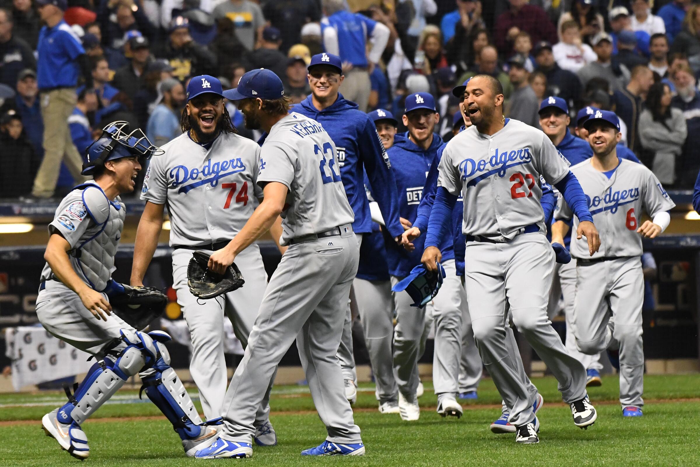 Dodgers teammates (from left) Austin Barnes, Kenley Jansen and Clayton Kershaw celebrate after winning the 2018 NLCS.