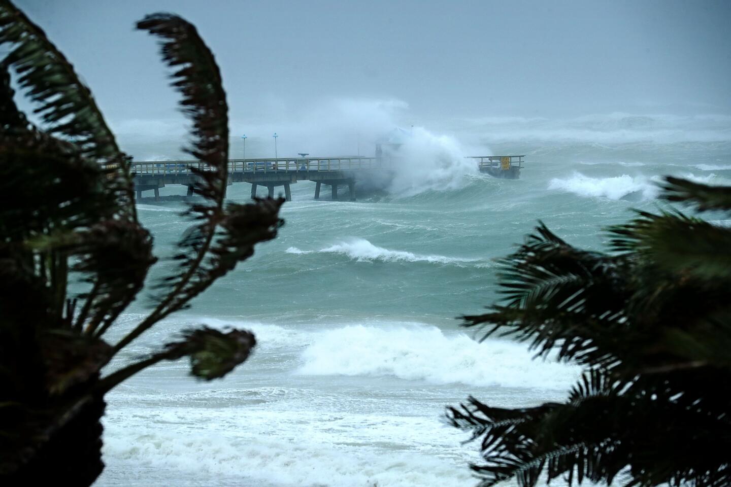 Large waves produced by Hurricane Irma crash into the end of Anglins Fishing Pier on Sept. 10, 2017, in Fort Lauderdale, Fla.
