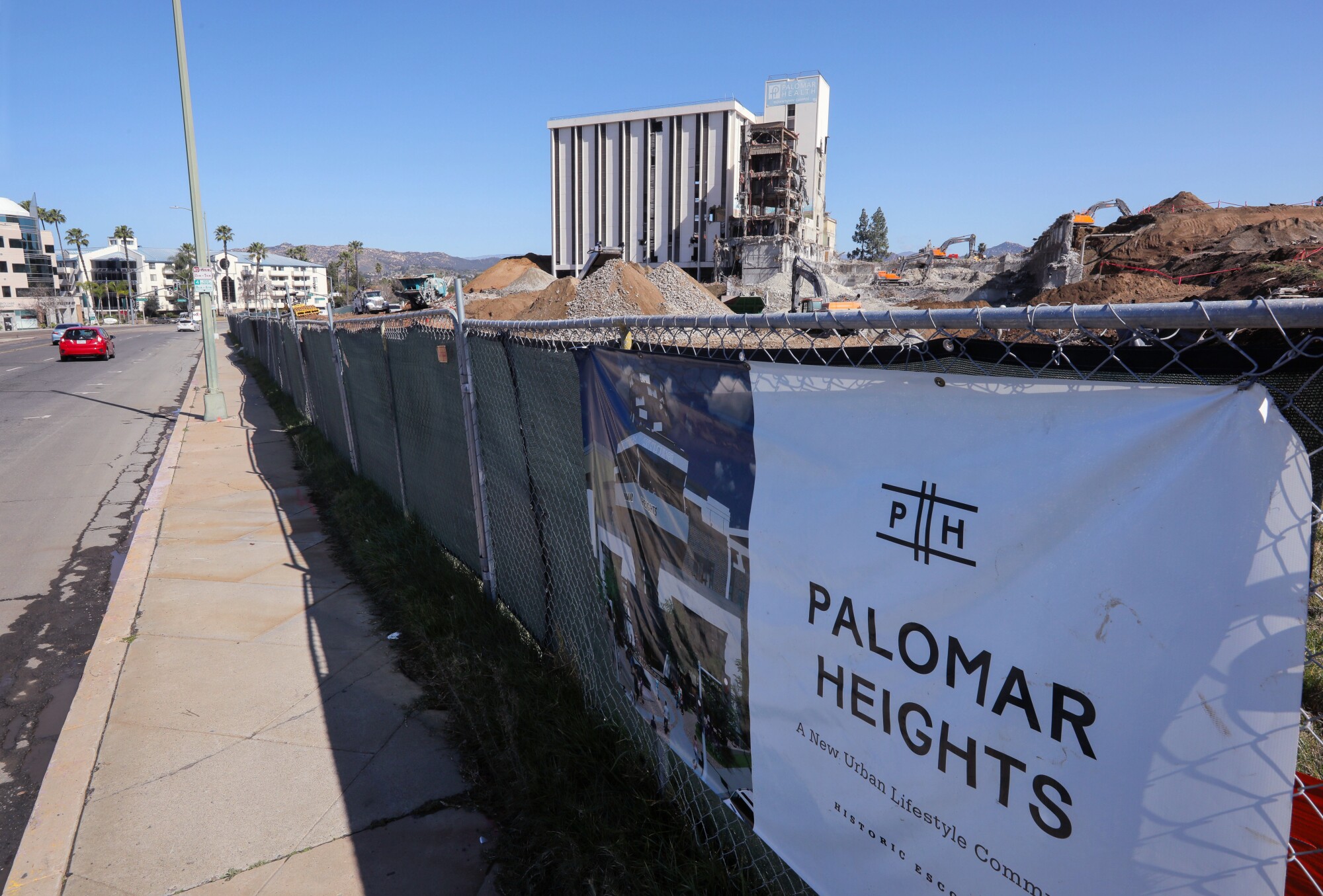A sign along Valley Boulevard promotes the development that will take its place.