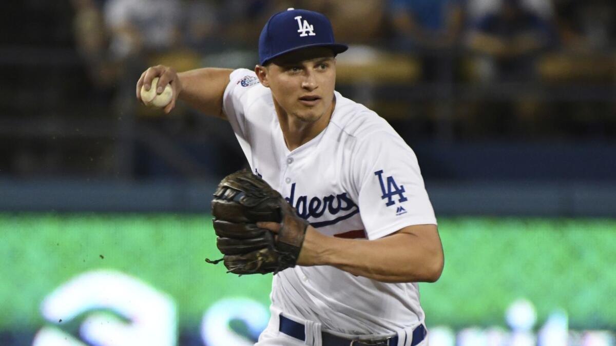 Dodgers shortstop Corey Seager throws to first base during a game against the Oakland Athletics in April.