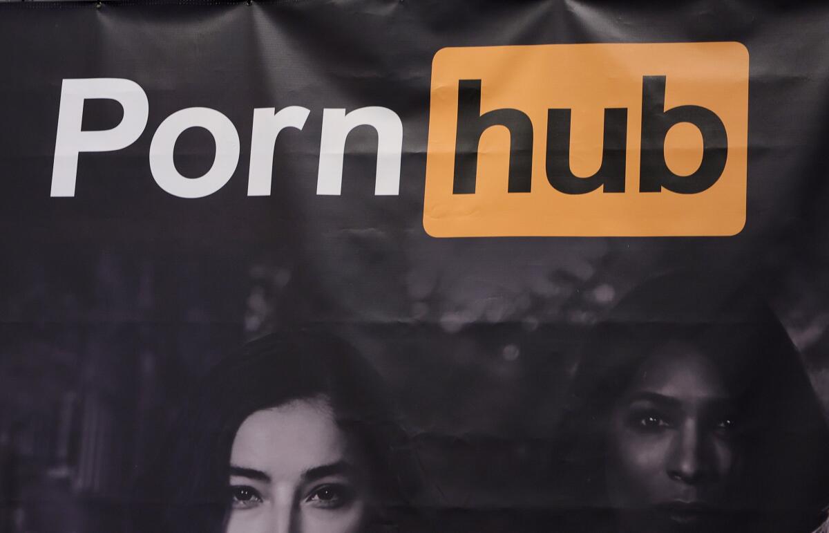 A sign with the Pornhub logo and two women's faces