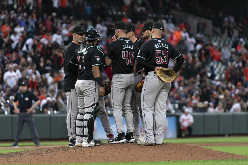 Arizona Diamondbacks relief pitcher Bryce Jarvis (40) talks to teammates during a baseball game against the Baltimore Orioles, Saturday, May 11, 2024, in Baltimore. (AP Photo/Jose Luis Magana)
