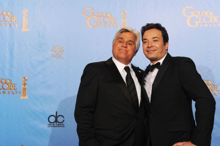 Presenters Jay Leno, left, and Jimmy Fallon pose in the press room during the 70th Annual Golden Globe Awards at the Beverly Hilton Hotel in Beverly Hills.