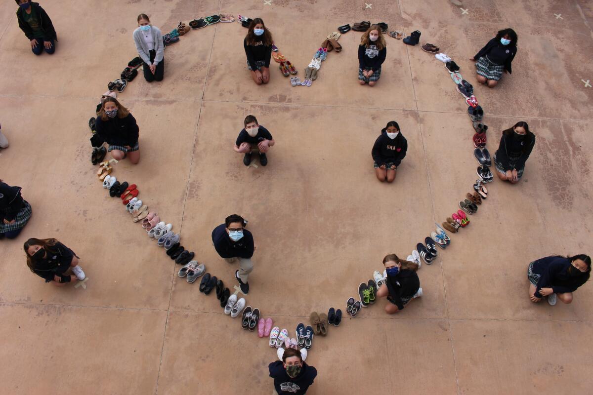Stella Maris Academy students collected shoes for Father Joe's Villages and arranged the donation in a heart shape.
