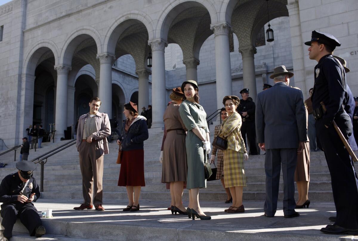 This scene from 2013’s “Gangster Squad” was filmed at Los Angeles City Hall. The production of feature films in Los Angeles County has fallen by half since 1996, according to FilmL.A. Inc.
