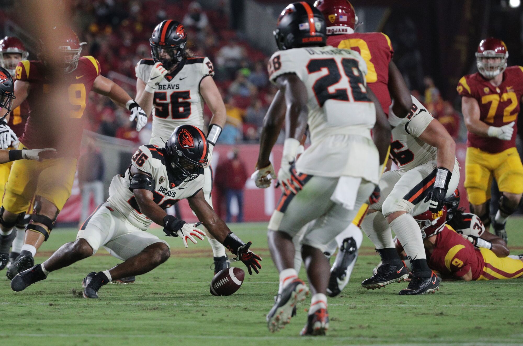 Oregon State linebacker Omar Speights recovers a fumble by USC quarterback Kedon Slovis in the third quarter.
