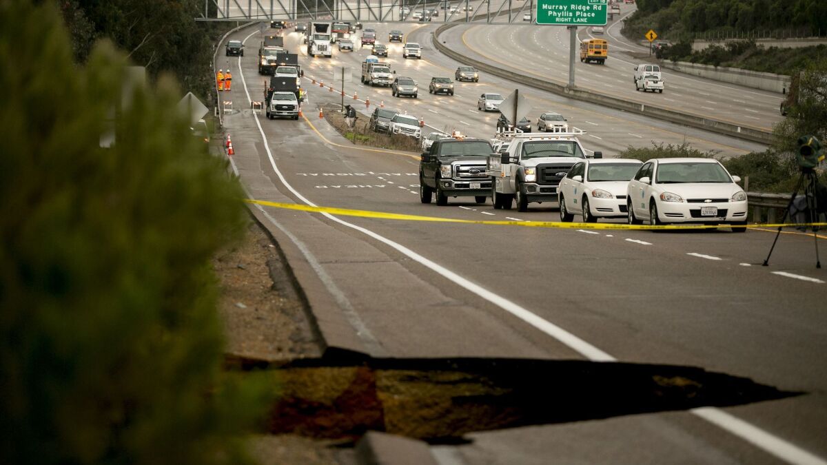 A large sinkhole developed on an onramp to Interstate 805 in San Diego.