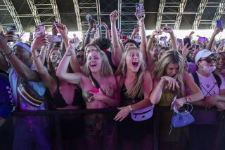 INDIO, CA - APRIL 15, 2022: Crowds of music fans cheer as City Girls perform on the Sahara stage on the first day of the Coachella Music Festival on April 15, 2022 in Indio, California.(Gina Ferazzi / Los Angeles Times)