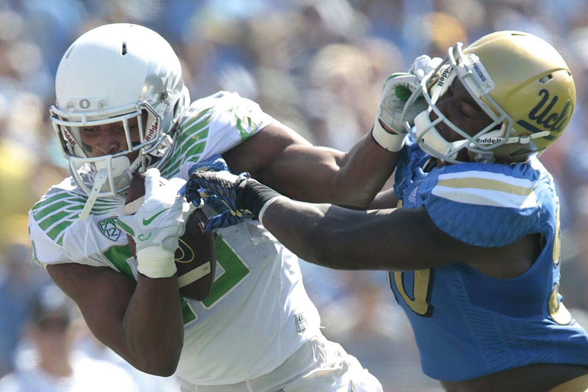 UCLA linebacker Myles Jack brings down Oregon tight end Pharaoh Brown after a reception on Oct. 11. Brown would be penalized for shoving Jack after the play ended.