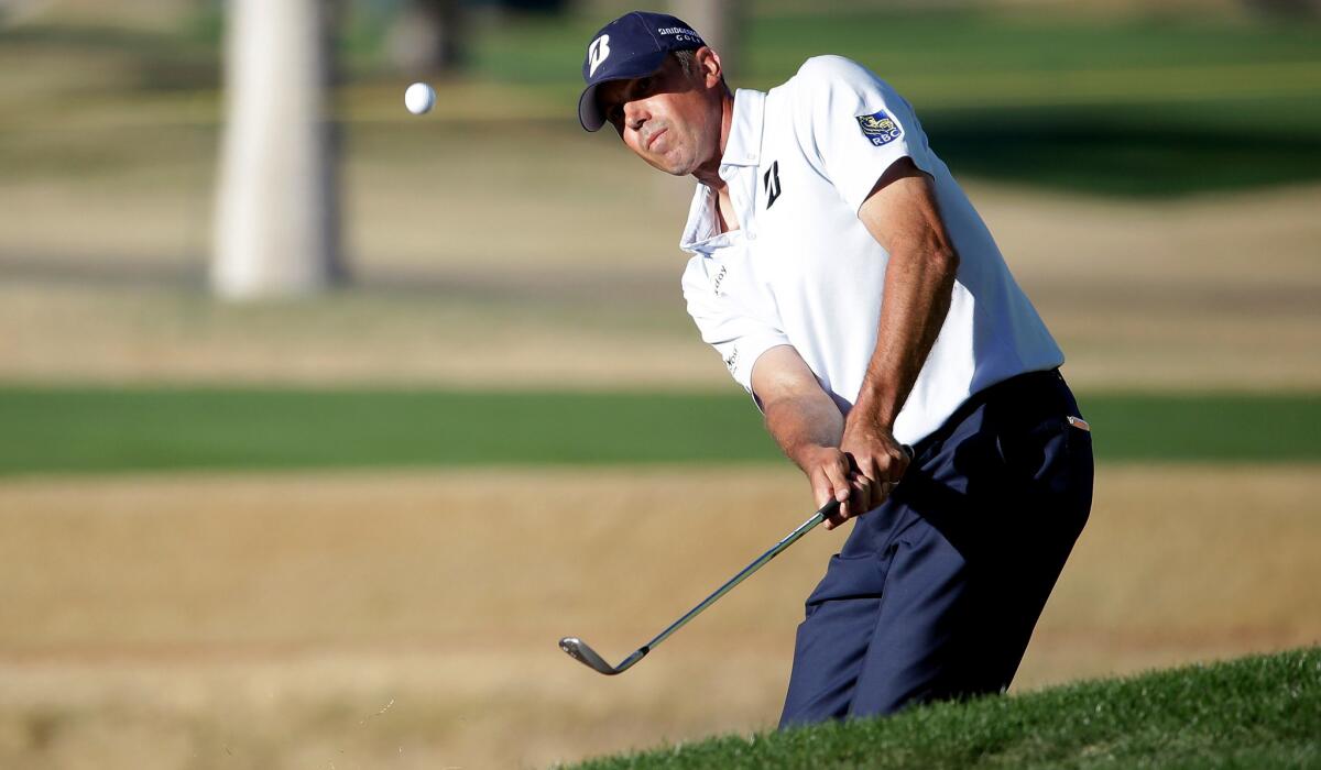 Matt Kuchar chips his ball onto the 18th green during the third round of the Humana Challenge on Saturday.