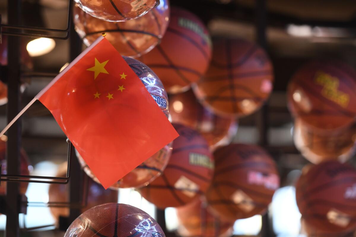 The Chinese flag is seen with a display of basketballs in the NBA store in Beijing this week.