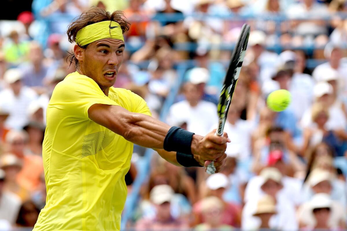Rafael Nadal returns a shot during his victory over John Isner in the Western & Southern Open final on Sunday.