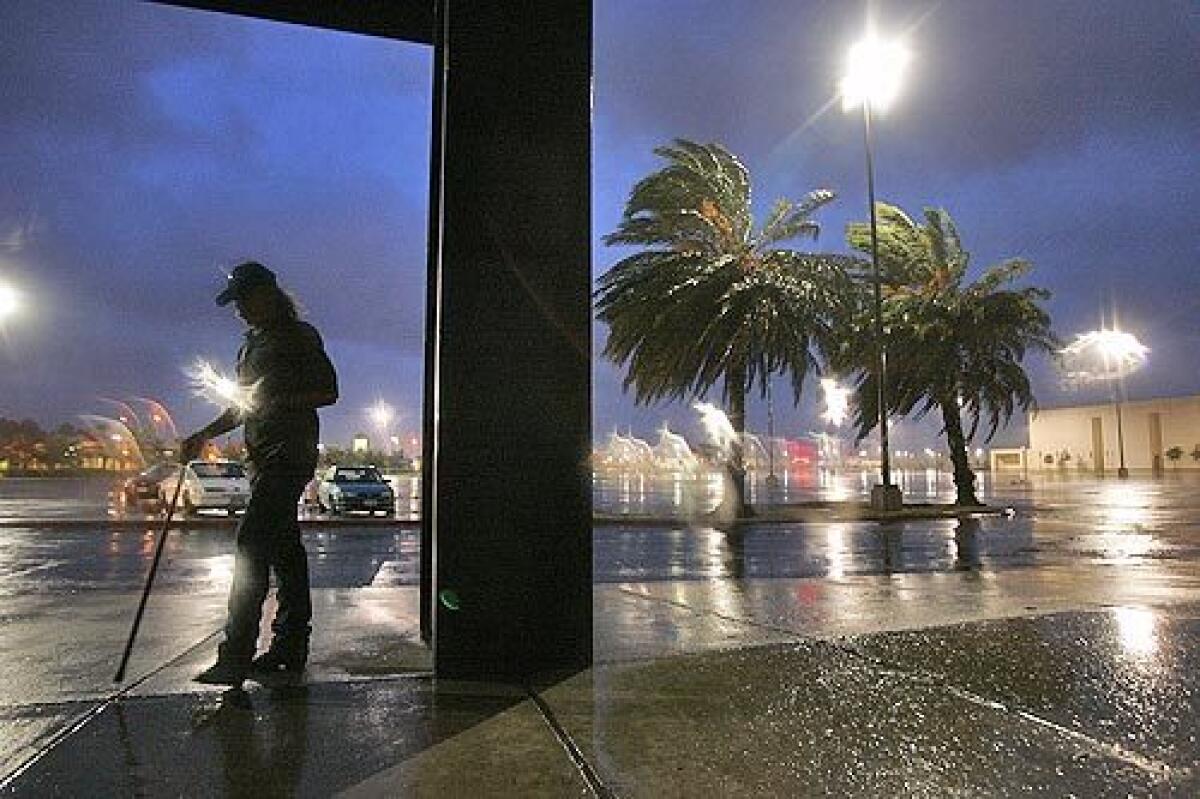 Larry McDougle, 53, of Beaumont, Texas, watches Hurricane Rita roll into the city from Hollywood Theaters, which became a makeshift shelter for those left behind in the city.