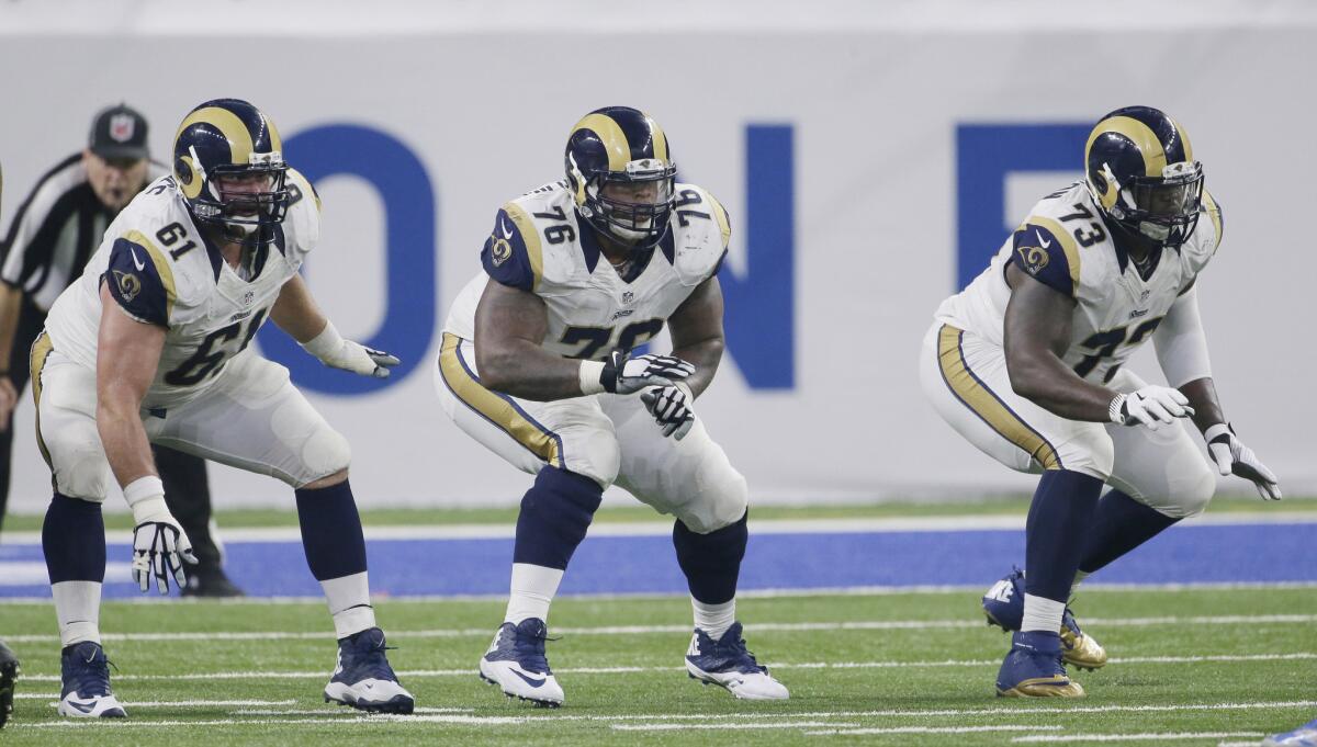 Rams center Tim Barnes (61), guard Rodger Saffold (76) and tackle Greg Robinson (73) in action during the second half of a game against the Detroit Lions on Oct. 16.