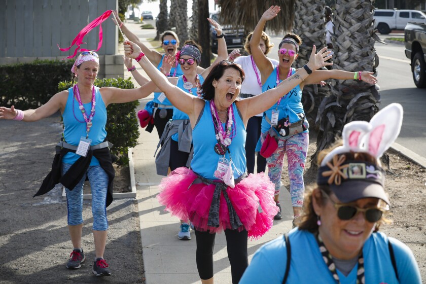 More Kantor, center, from Raleigh, N.C., walks with her "tribe" dressed in blue and pink.