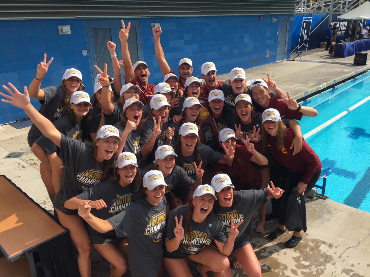 The USC's women's water polo team celebrates after defeating UCLA to win the 2021 NCAA water polo title.