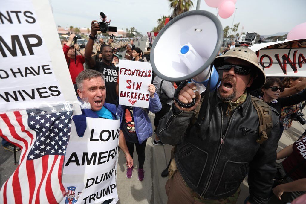 Protesters against President Trump rally in Otay Mesa as the president tours border wall prototypes on March 13.
