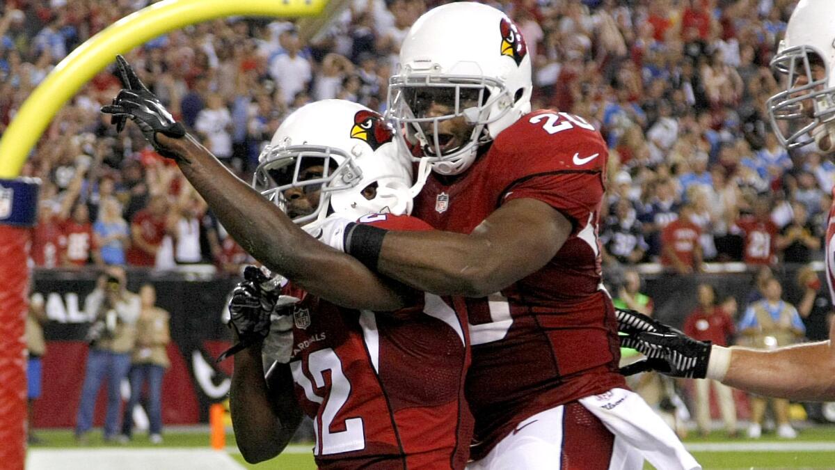Arizona Cardinals wide receiver John Brown, left, celebrates with teammate Jonathan Dwyre after scoring on a touchdown catch in the fourth quarter of an 18-17 victory over the San Diego Chargers on Monday.