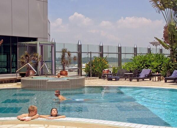 The Transit Hotel at Terminal 1 in Singapore's Changi Airport has a pool that overlooks the runway. A six-hour stay costs about $50.