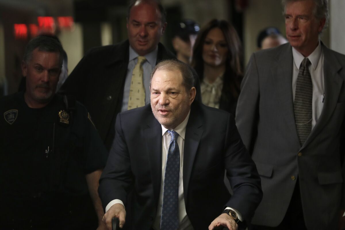 FILE - Harvey Weinstein arrives at a Manhattan courthouse for jury deliberations in his rape trial on Feb. 24, 2020, in New York. A New York appeals court blasted Manhattan prosecutors Wednesday, Dec. 15, 2021, for filling out Weinstein’s rape trial last year with what one judge deemed “incredibly prejudicial testimony” from women whose allegations weren’t part of the criminal charges against him — a strategy that now has the potential to jeopardize the disgraced movie mogul’s conviction. (AP Photo/Seth Wenig, File)
