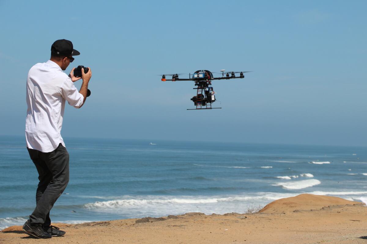 This image provided by Aerial MOB, LLC, shows their eight rotor Sky Jib Helicopter in San Diego, Calif., in August 2013.