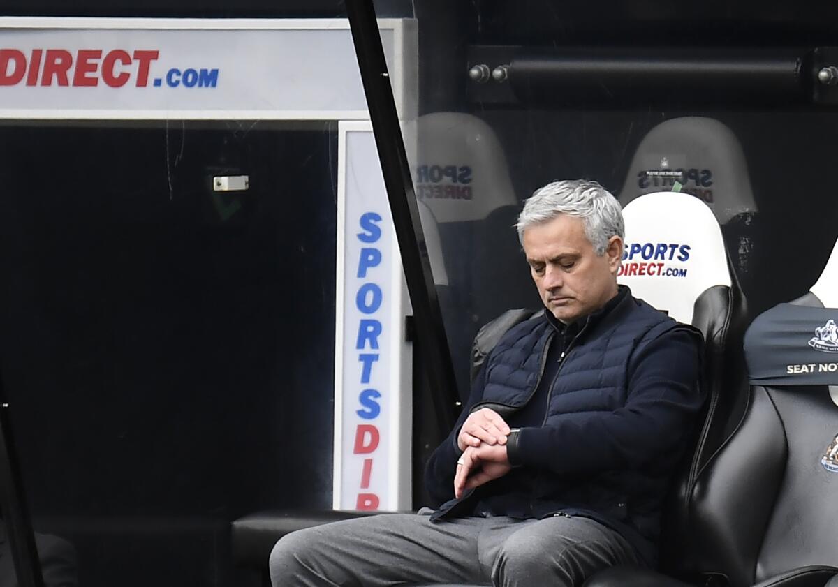 Tottenham's manager Jose Mourinho check his watch during the English Premier League soccer match between Newcastle United and Tottenham Hotspur at St. James' Park in Newcastle, England, Sunday, April 4, 2021. (Peter Powell/Pool via AP)