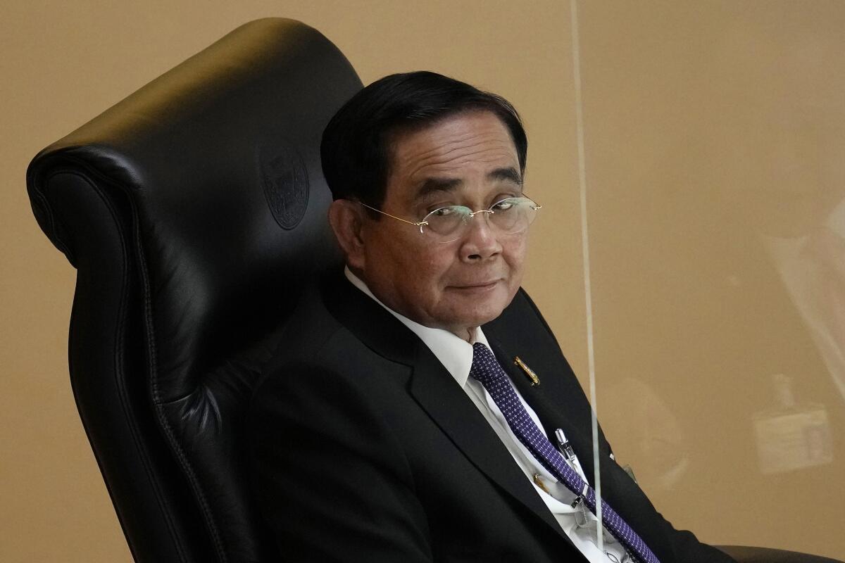 FILE - Thailand Prime Minister Prayuth Chan-ocha attends a no-confidence debate at the Parliament in Bangkok, Thailand, on July 19, 2022. Thailand’s Constitutional Court announced Wednesday, Sept. 14, 2022, that it will issue a ruling on Sept. 30 on whether Prayuth has already served the eight-year legal limit in the position and must step down. (AP Photo/Sakchai Lalit, File)