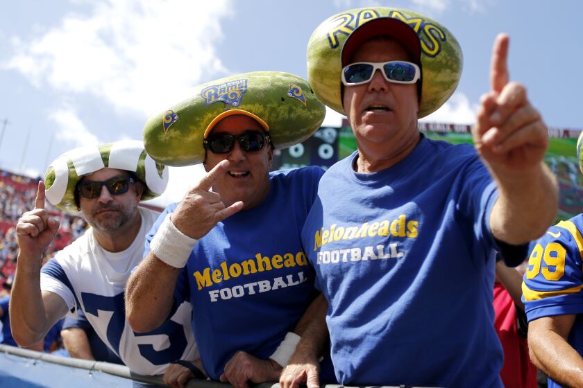 LOS ANGELES, CALIFORNIA - SEPTEMBER 29: Fans of the Los Angeles Rams pose for a photo ahead of a game against the Tampa Bay Buccaneers at Los Angeles Memorial Coliseum on September 29, 2019 in Los Angeles, California. (Photo by Katharine Lotze/Getty Images)
