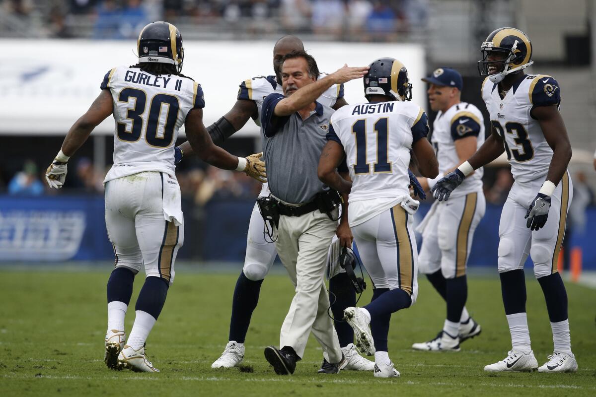 Rams Coach Jeff Fisher cheers Tavon Austin and Todd Gurley after a first-quarter touchdown against the Miami Dolphins on Nov. 20.