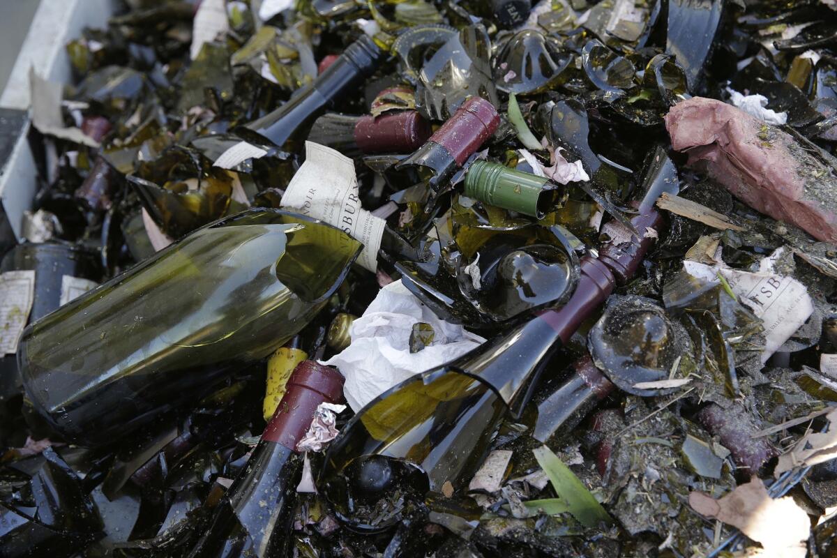 Broken bottles fill a grape bin at Saintsbury winery in Napa, Calif., after Sundays earthquake.