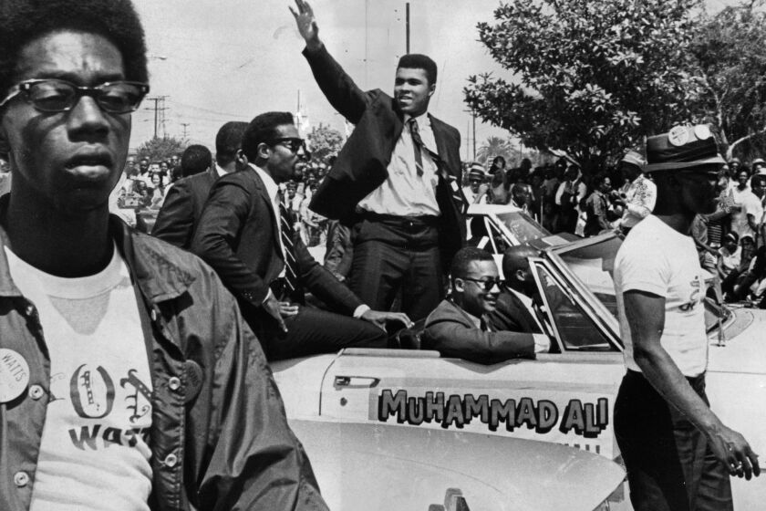 Muhammad Ali as grand marshal of the parade ending the Watts Summer Festival in August 1967