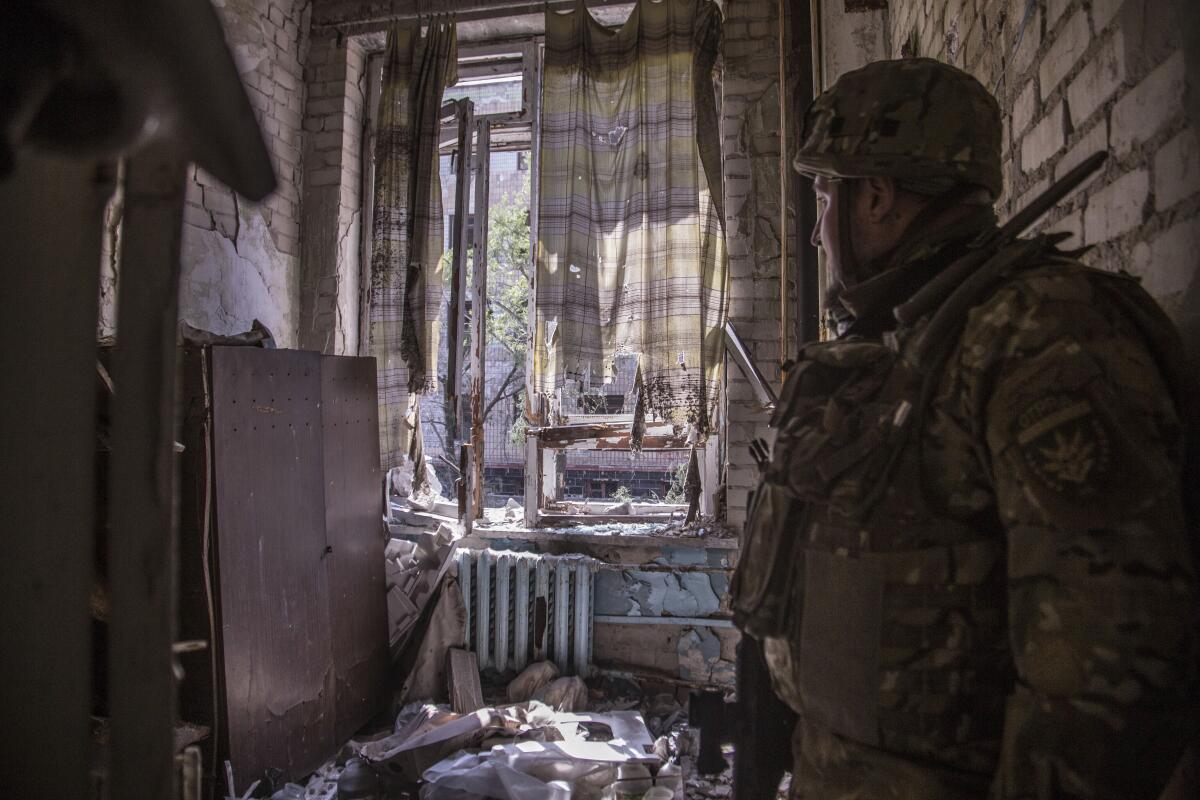 Ukrainian soldier in position inside a building