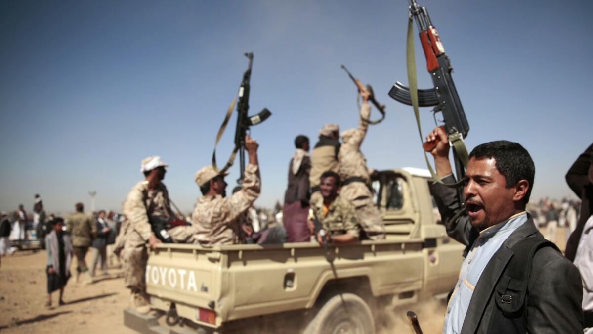 A tribesman loyal to the Houthi rebels, right, chants slogans during a gathering aimed at mobilizing more fighters in in 2017.