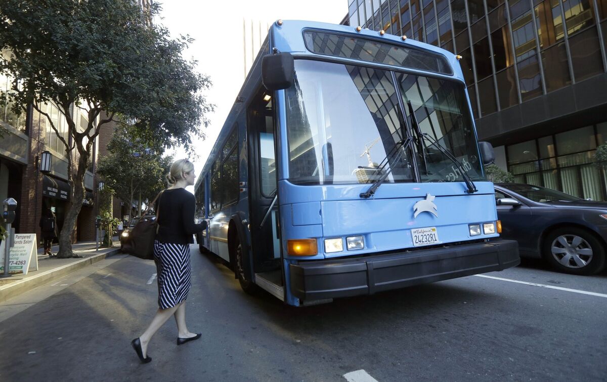A woman boards a Leap bus in San Francisco on April 14.