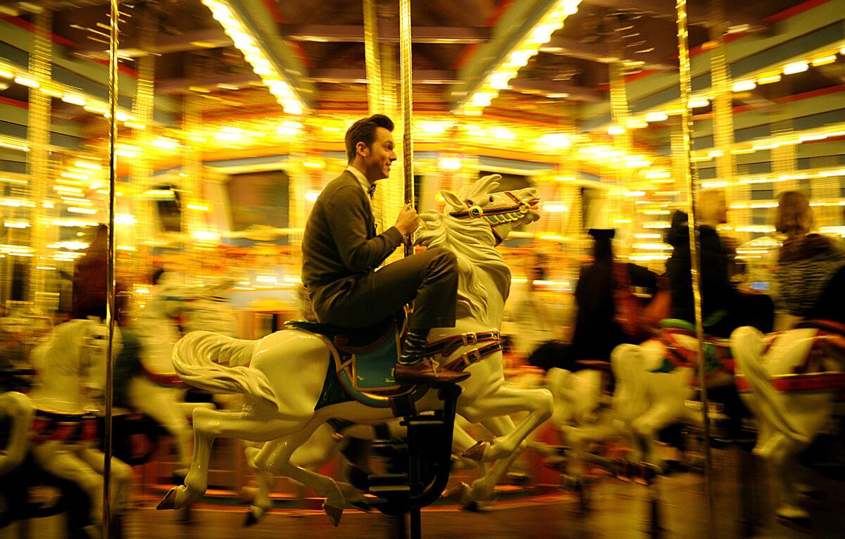 On the carousel, Nathaniel Marshall, 22, of Tustin sports what he called a "genteel" look: brown cardigan, high-waisted green pants and brown shoes with cream-colored laces (accented by gray socks emblazoned with white handlebar mustaches). "It's a respect for yourself, but it's ultimately a respect for other people," he said of being smartly dressed. He recalled a line he'd heard: "One of the most polite things you can do for other people is to dress nicely, because you're not being an eyesore."